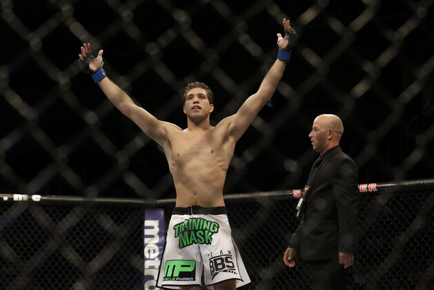 Brian Ortega celebrates after beating Michael De La Torre by submission during the first round of a featherweight mixed martial arts bout at a UFC on Fox event in San Jose, Calif., Saturday, July 26, 2014. (AP Photo/Jeff Chiu) Brian Ortega celebrates after beating Michael De La Torre by submission during the first round of a featherweight mixed martial arts bout at a UFC on Fox event in San Jose, Calif., Saturday, July 26, 2014. (AP Photo/Jeff Chiu)