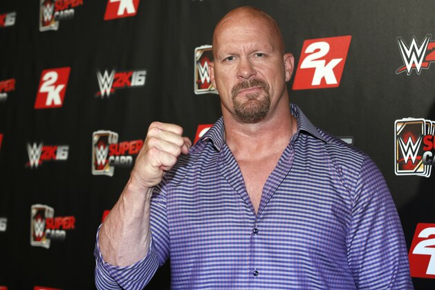 IMAGE DISTRIBUTED FOR 2K - WWE Hall of Famer and WWE 2K16 cover, Superstar Stone Cold Steve Austin arrives on the red carpet at the WWE 2K SummerSlam Kickoff in New York, N.Y., on Thursday, Aug. 20, 2015. (Photo by Stuart Ramson/Invision for 2K/AP Images) IMAGE DISTRIBUTED FOR 2K - WWE Hall of Famer and WWE 2K16 cover, Superstar Stone Cold Steve Austin arrives on the red carpet at the WWE 2K SummerSlam Kickoff in New York, N.Y., on Thursday, Aug. 20, 2015. (Photo by Stuart Ramson/Invision for 2K/AP Images)
