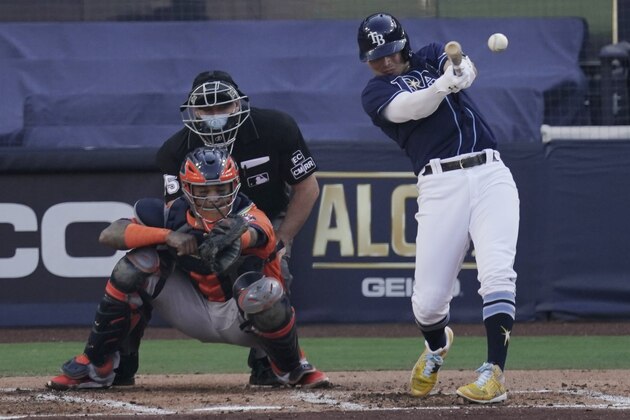 Tampa Bay Rays' Willy Adames hits an RBI double against the Houston Astros during the second inning in Game 6 of a baseball American League Championship Series, Friday, Oct. 16, 2020, in San Diego. (AP Photo/Jae C. Hong)