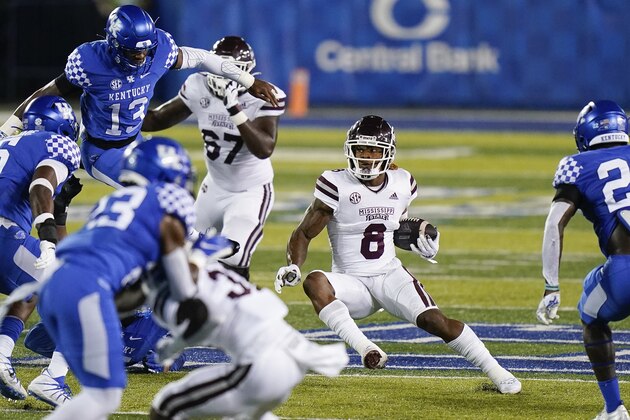 Mississippi State running back Kylin Hill (8) runs with the ball during the first half of an NCAA college football game against Kentucky, Saturday, Oct. 10, 2020, in Lexington, Ky. (AP Photo/Bryan Woolston)