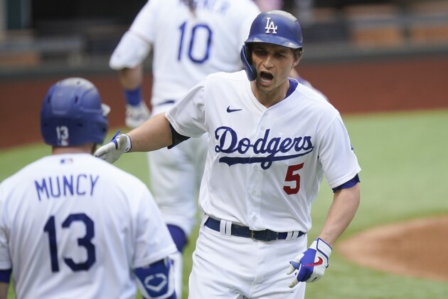 Los Angeles Dodgers' Corey Seager celebrates his home run against the Atlanta Braves during the first inning in Game 6 of a baseball National League Championship Series Saturday, Oct. 17, 2020, in Arlington, Texas. (AP Photo/Eric Gay)