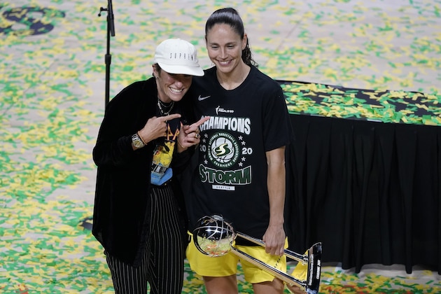 Seattle Storm guard Sue Bird, right, poses for a photo with girlfriend Megan Rapinoe after the Storm won basketball's WNBA Championship Tuesday, Oct. 6, 2020, in Bradenton, Fla. (AP Photo/Chris O'Meara)