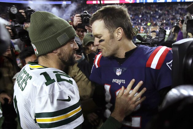 Green Bay Packers quarterback Aaron Rodgers, left, and New England Patriots quarterback Tom Brady speak at midfield after an NFL football game, Sunday, Nov. 4, 2018, in Foxborough, Mass. (AP Photo/Charles Krupa) Green Bay Packers quarterback Aaron Rodgers, left, and New England Patriots quarterback Tom Brady speak at midfield after an NFL football game, Sunday, Nov. 4, 2018, in Foxborough, Mass. (AP Photo/Charles Krupa)
