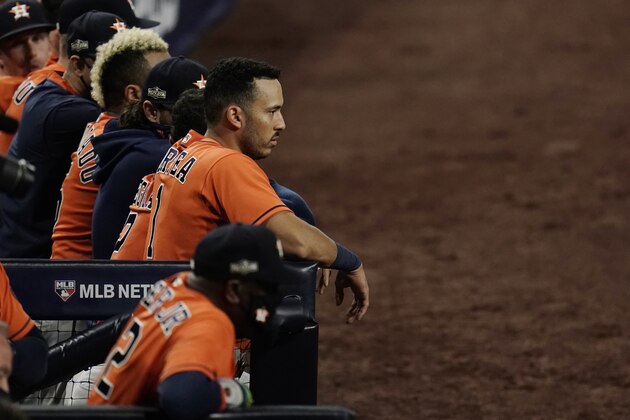 Houston Astros Carlos Correa watches the eighth inning from the dugout in Game 7 of a baseball American League Championship Series, Saturday, Oct. 17, 2020, in San Diego. (AP Photo/Gregory Bull) Houston Astros Carlos Correa watches the eighth inning from the dugout in Game 7 of a baseball American League Championship Series, Saturday, Oct. 17, 2020, in San Diego. (AP Photo/Gregory Bull)