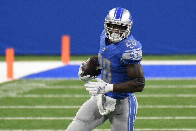 Detroit Lions running back Adrian Peterson rushes during the second half of an NFL football game against the New Orleans Saints, Sunday, Oct. 4, 2020, in Detroit. (AP Photo/Jose Juarez)