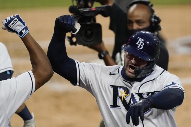 Tampa Bay Rays' Mike Zunino celebrates his solo home run against the Houston Astros during the second inning in Game 7 of a baseball American League Championship Series, Saturday, Oct. 17, 2020, in San Diego. (AP Photo/Ashley Landis)