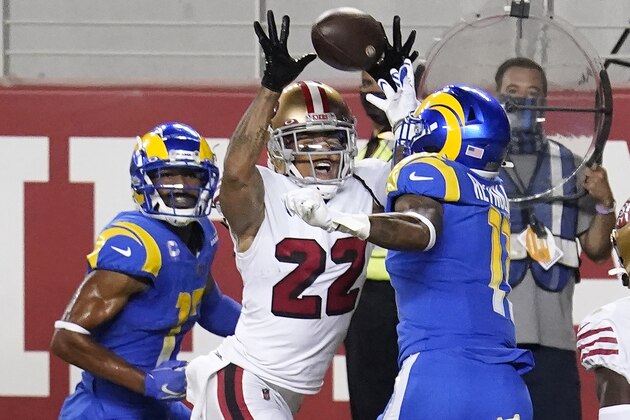 San Francisco 49ers cornerback Jason Verrett (22) intercepts a pass in the end zone between Los Angeles Rams wide receiver Robert Woods, left, and Josh Reynolds during the second half of an NFL football game in Santa Clara, Calif., Sunday, Oct. 18, 2020. (AP Photo/Tony Avelar)