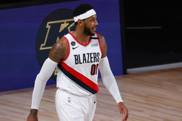 Portland Trail Blazers' Carmelo Anthony reacts after being charged with an offensive foul against the Los Angeles Lakers in Game 4 of an NBA basketball first-round playoff series, Monday, Aug. 24, 2020, in Lake Buena Vista, Fla. (Kevin C. Cox/Pool Photo via AP) Portland Trail Blazers' Carmelo Anthony reacts after being charged with an offensive foul against the Los Angeles Lakers in Game 4 of an NBA basketball first-round playoff series, Monday, Aug. 24, 2020, in Lake Buena Vista, Fla. (Kevin C. Cox/Pool Photo via AP)