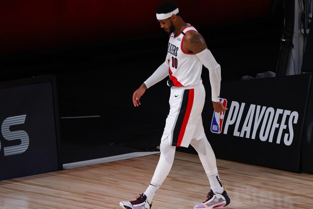 Portland Trail Blazers' Carmelo Anthony leaves the court at halftime during Game 4 of an NBA basketball first-round playoff series against the Los Angeles Lakers, Monday, Aug. 24, 2020, in Lake Buena Vista, Fla. (Kevin C. Cox/Pool Photo via AP) Portland Trail Blazers' Carmelo Anthony leaves the court at halftime during Game 4 of an NBA basketball first-round playoff series against the Los Angeles Lakers, Monday, Aug. 24, 2020, in Lake Buena Vista, Fla. (Kevin C. Cox/Pool Photo via AP)