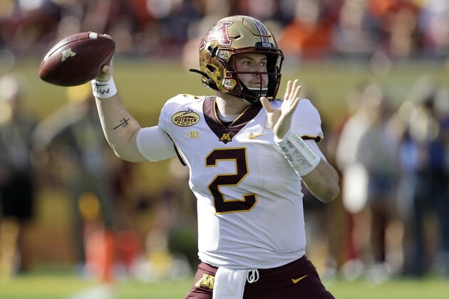 FILE - In this Wednesday, Jan. 1, 2020, file photo, Minnesota quarterback Tanner Morgan (2) throws a pass against Auburn during the first half of the Outback Bowl NCAA college football game, in Tampa, Fla. Minnesota is scheduled to begin their season against Michigan on Oct. 24. (AP Photo/Chris O'Meara, File) FILE - In this Wednesday, Jan. 1, 2020, file photo, Minnesota quarterback Tanner Morgan (2) throws a pass against Auburn during the first half of the Outback Bowl NCAA college football game, in Tampa, Fla. Minnesota is scheduled to begin their season against Michigan on Oct. 24. (AP Photo/Chris O'Meara, File)