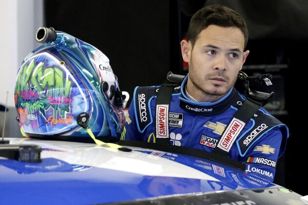 FILE - In this Feb. 14, 2020, file photo, Kyle Larson gets ready to climb into his car to practice for the NASCAR Daytona 500 auto race at Daytona International Speedway in Daytona Beach, Fla. Kyle Larson used a racial slur on a live stream Sunday. April 12, 2020, during a virtual race â€” the second driver in a week to draw scrutiny while using the online racing platform to fill time during the coronavirus pandemic.(AP Photo/Terry Renna, File)