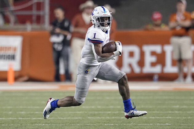 FILE - In this Oct. 19, 2019, file photo, Kansas' Pooka Williams Jr. (1) runs for a long gain against Texas during the second half of an NCAA college football game, in Austin, Texas. Pooka Williams was selected to The Associated Press All-Big 12 Conference team, Friday, Dec. 13, 2019. (AP Photo/Chuck Burton, File)