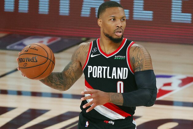 Portland Trail Blazers' Damian Lillard (0) dribbles during the second half of an NBA basketball game against the Houston Rockets Tuesday, Aug. 4, 2020, in Lake Buena Vista, Fla. (Kevin C. Cox/Pool Photo via AP)