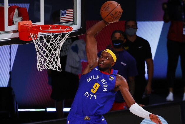 Denver Nuggets' Jerami Grant slam-dunks against the Utah Jazz during double overtime of an NBA basketball game Saturday, Aug. 8, 2020, in Lake Buena Vista, Fla. (Kevin C. Cox/Pool Photo via AP)