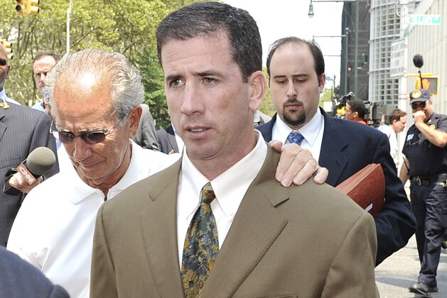 Former NBA referee Tim Donaghy exits Brooklyn federal court following his sentencing, Tuesday, July 29, 2008, in New York. Donaghy was sentenced to 15 months in prison Tuesday for setting off a gambling scandal that tarnished the league's reputation and raised questions about the integrity of its officiating. (AP Photo/ Louis Lanzano)