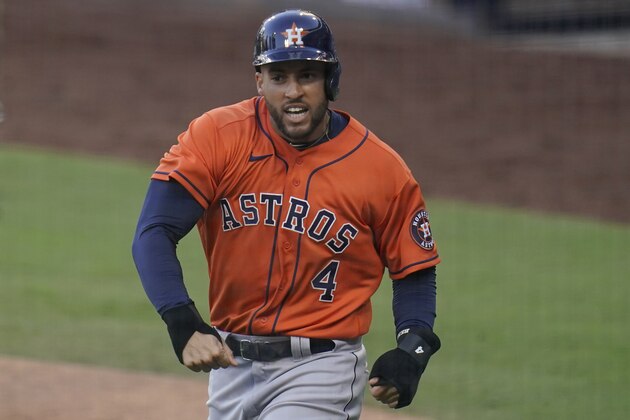 Houston Astros George Springer reacts after scoring on a single by Jose Altuve against the Tampa Bay Rays during the fifth inning in Game 6 of a baseball American League Championship Series, Friday, Oct. 16, 2020, in San Diego. (AP Photo/Gregory Bull)