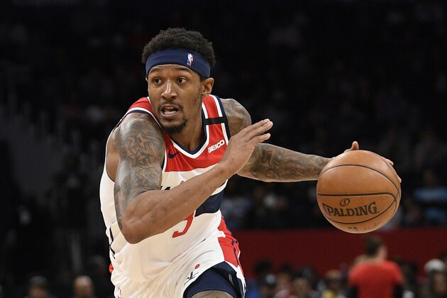 FILE - In this March 8, 2020, file photo, Washington Wizards guard Bradley Beal drives during an NBA basketball game against the Miami Heat in Washington. Wizards leading scorer Bradley Beal won't take part in the restart of the NBA season because of a right rotator cuff injury. (AP Photo/Nick Wass, File)