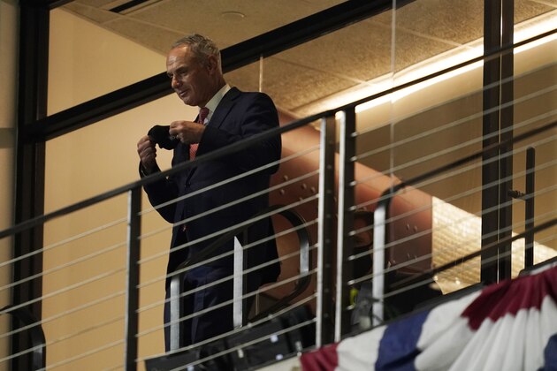 Major League Baseball Commissioner Rob Manfred watches Game 1 of the baseball World Series Tuesday between the Tampa Bay Rays and the Los Angeles Dodgers, Oct. 20, 2020, in Arlington, Texas. (AP Photo/Tony Gutierrez)