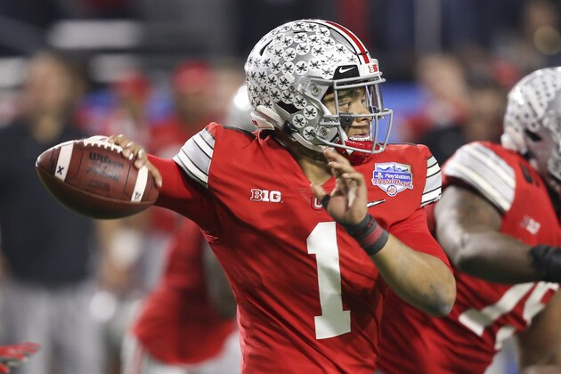 Ohio State quarterback Justin Fields throws a pass against Clemson during the second half of the Fiesta Bowl NCAA college football playoff semifinal Saturday, Dec. 28, 2019, in Glendale, Ariz. (AP Photo/Ross D. Franklin)