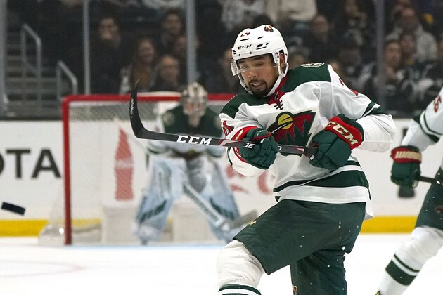 Minnesota Wild defenseman Matt Dumba passes the puck during the first period of an NHL hockey game against the Los Angeles Kings Saturday, March 7, 2020, in Los Angeles. (AP Photo/Mark J. Terrill)