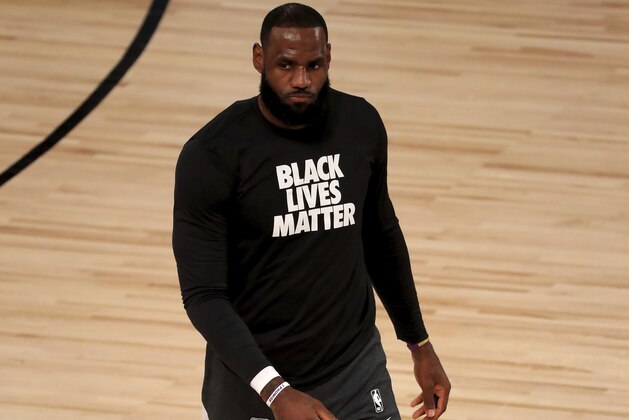 Los Angeles Lakers' LeBron James wears a Black Lives Matter shirt as he takes to the court prior to an NBA basketball game against the Los Angeles Clippers, Thursday, July 30, 2020, in Lake Buena Vista, Fla. (Mike Ehrmann/Pool Photo via AP)