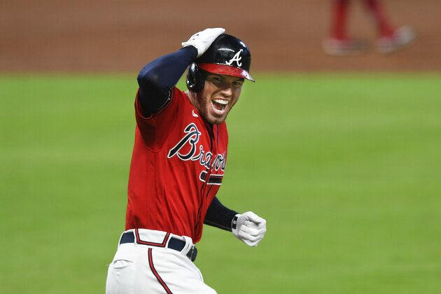 Atlanta Braves' Freddie Freeman reacts as he runs the first base line during a grand slam to center field during the fourth inning of the second baseball game of a doubleheader against the Washington Nationals, Friday, Sept. 4, 2020, in Atlanta. (AP Photo/John Amis)