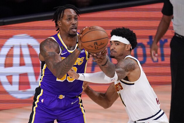Los Angeles Lakers' Dwight Howard (39) is defended by Denver Nuggets' Gary Harris, right, during the first half of an NBA conference final playoff basketball game Saturday, Sept. 26, 2020, in Lake Buena Vista, Fla. (AP Photo/Mark J. Terrill)