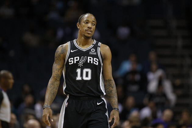San Antonio Spurs forward DeMar DeRozan stands on the court during the first half of an NBA basketball game against the Charlotte Hornets in Charlotte, N.C., Tuesday, March 3, 2020. San Antonio won 104-103. (AP Photo/Nell Redmond)