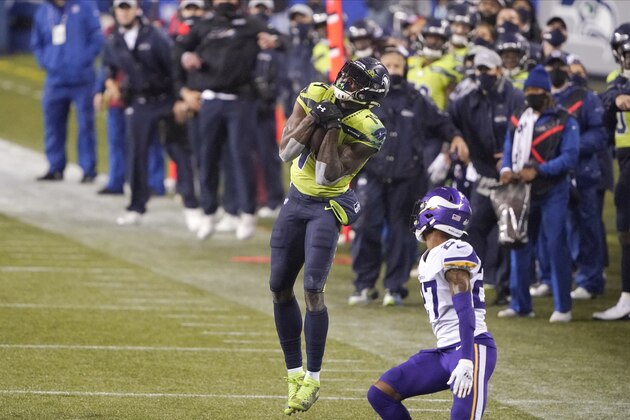 Seattle Seahawks' DK Metcalf leaps to make a catch against the Minnesota Vikings late in the second half of an NFL football game, Sunday, Oct. 11, 2020, in Seattle. (AP Photo/Ted S. Warren)