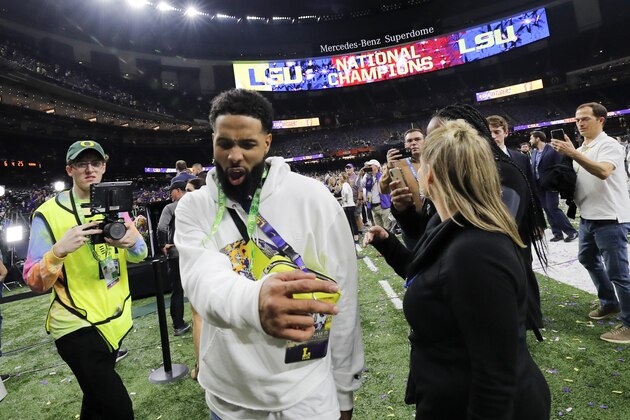 FILE - In this Tuesday, Jan. 14, 2020 photo, Cleveland Browns wide receiver and former LSU star Odell Beckham Jr. walks off the field after the NCAA College Football Playoff national championship game between Clemson and LSU in New Orleans. The New Orleans Police Department said Saturday, Jan 18, 2020, that a misdemeanor simple battery warrant for Beckham has been rescinded. (AP Photo/Gerald Herbert, File)