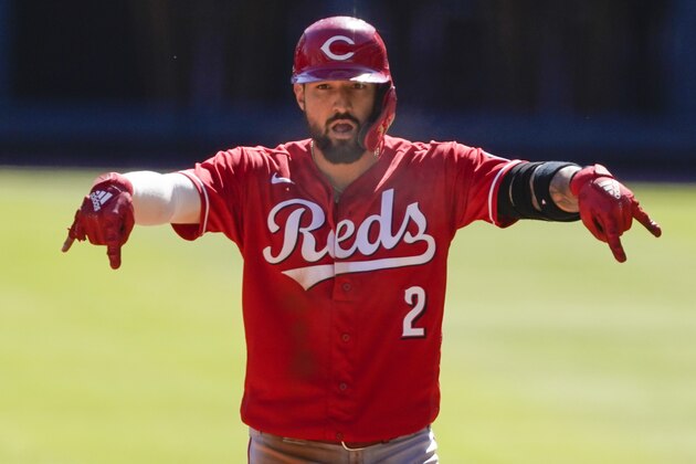 Cincinnati Reds right fielder Nick Castellanos (2) reacts to hitting a double against the Atlanta Braves in 11th inning during Game 1 of a National League wild-card baseball series, Wednesday, Sept. 30, 2020, in Atlanta. (AP Photo/John Bazemore)
