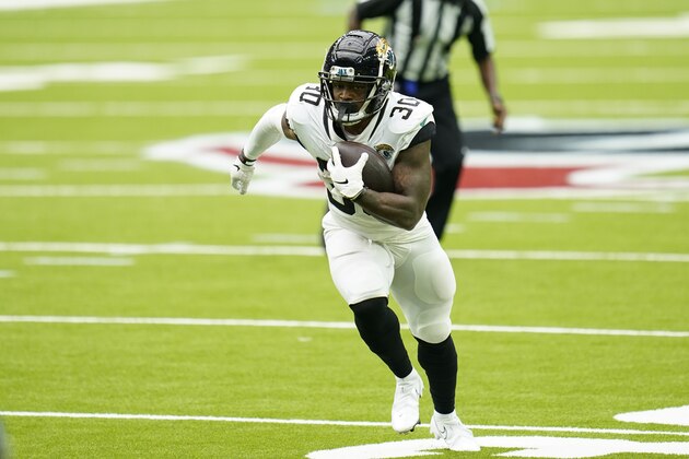 Jacksonville Jaguars running back James Robinson (30) carries the ball during an NFL football game against the Houston Texans, Sunday, Oct. 11, 2020, in Houston. (AP Photo/Matt Patterson)