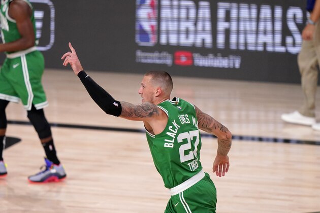 Boston Celtics center Daniel Theis (27) celebrates dunking against the Miami Heat during the second half of Game 4 of an NBA basketball Eastern Conference final, Wednesday, Sept. 23, 2020, in Lake Buena Vista, Fla. (AP Photo/Mark J. Terrill)