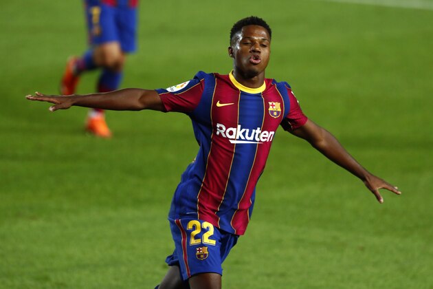 Barcelona's Ansu Fati celebrates scoring the opening goal during the Spanish La Liga soccer match between FC Barcelona and Villareal FC at the Camp Nou stadium in Barcelona, Spain, Sunday, Sept. 27, 2020. (AP Photo/Joan Monfort)