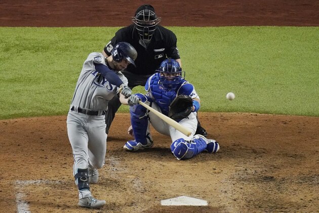 Tampa Bay Rays' Brandon Lowe his a two-run home run against the Los Angeles Dodgers during the fifth inning in Game 2 of the baseball World Series Wednesday, Oct. 21, 2020, in Arlington, Texas. (AP Photo/Sue Ogrocki)