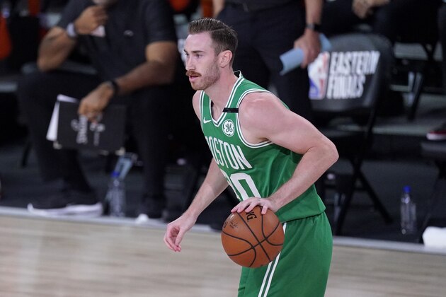Boston Celtics forward Gordon Hayward (20) handles the ball during the first half of an NBA conference final playoff basketball game against the Miami Heat on Saturday, Sept. 19, 2020, in Lake Buena Vista, Fla. (AP Photo/Mark J. Terrill)