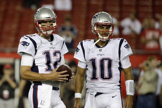 New England Patriots quarterback Tom Brady (12) and quarterback Jimmy Garoppolo (10) warm up before an NFL football game against the Tampa Bay Buccaneers, Thursday, Oct. 5, 2017, in Tampa, Fla. (AP Photo/John Raoux)