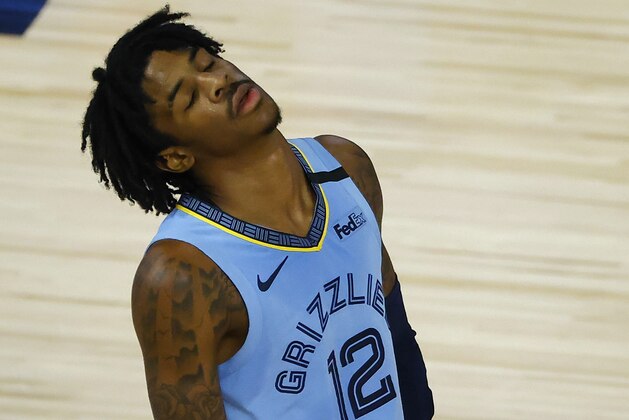 Memphis Grizzlies' Ja Morant  reacts after a losing to the Portland Trail Blazers in an NBA basketball game Saturday, Aug. 15, 2020, in Lake Buena Vista, Fla. (Kevin C. Cox/Pool Photo via AP)