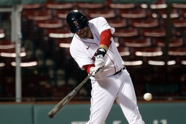 Boston Red Sox's J.D. Martinez hits a single during the fifth inning of a baseball game against the Tampa Bay Rays, Monday, Aug. 10, 2020, in Boston. (AP Photo/Michael Dwyer)