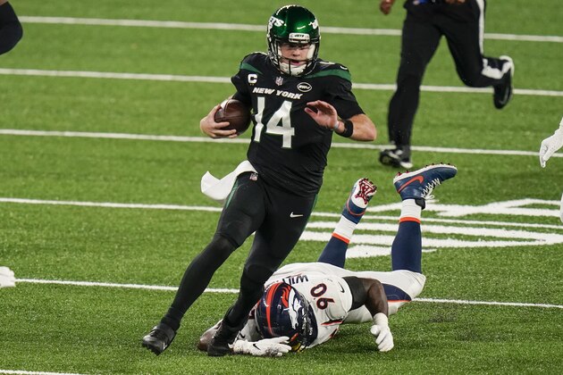 New York Jets quarterback Sam Darnold (14) gets past Denver Broncos' DeShawn Williams while rushing for a touchdown during the first half of an NFL football game Thursday, Oct. 1, 2020, in East Rutherford, N.J. (AP Photo/Seth Wenig) New York Jets quarterback Sam Darnold (14) gets past Denver Broncos' DeShawn Williams while rushing for a touchdown during the first half of an NFL football game Thursday, Oct. 1, 2020, in East Rutherford, N.J. (AP Photo/Seth Wenig)