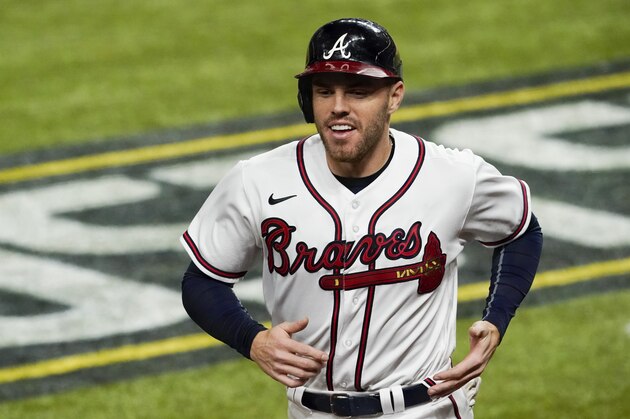 Atlanta Braves' Freddie Freeman smiles after scoring on a hit by Marcell Ozuna against the Los Angeles Dodgers during the sixth inning in Game 4 of a baseball National League Championship Series Thursday, Oct. 15, 2020, in Arlington, Texas. (AP Photo/Tony Gutierrez) Atlanta Braves' Freddie Freeman smiles after scoring on a hit by Marcell Ozuna against the Los Angeles Dodgers during the sixth inning in Game 4 of a baseball National League Championship Series Thursday, Oct. 15, 2020, in Arlington, Texas. (AP Photo/Tony Gutierrez)