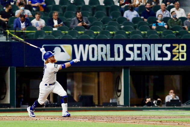 A limited number of spectators watch the Los Angeles Dodgers play against the Tampa Bay Rays during the first inning in Game 2 of the baseball World Series Wednesday, Oct. 21, 2020, in Arlington, Texas. (AP Photo/Sue Ogrocki)