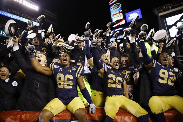 Navy midshipmen and players celebrate after defeating Army 31-7 in an NCAA college football game, Saturday, Dec. 14, 2019, in Philadelphia. (AP Photo/Matt Rourke) Navy midshipmen and players celebrate after defeating Army 31-7 in an NCAA college football game, Saturday, Dec. 14, 2019, in Philadelphia. (AP Photo/Matt Rourke)