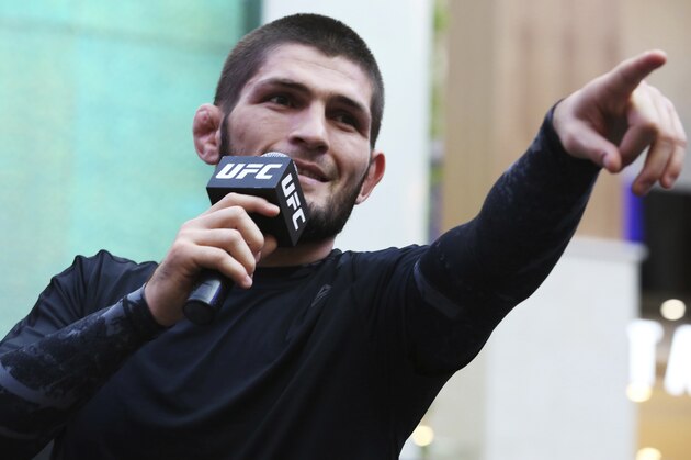 Russian UFC fighter Khabib Nurmagomedov gestures to the crowd during an open training session at Yas Mall in Abu Dhabi, United Arab Emirates, Wednesday, Sept. 4, 2019. Fighters Dustin Poirier and Khabib Nurmagomedov will face each other in UFC 242, which will be held Saturday, Sept. 7, 2019, in Abu Dhabi. Nurmagomedov did not spar during the open training, saying he was still trying to make weight for the bout. (AP Photo/Jon Gambrell)