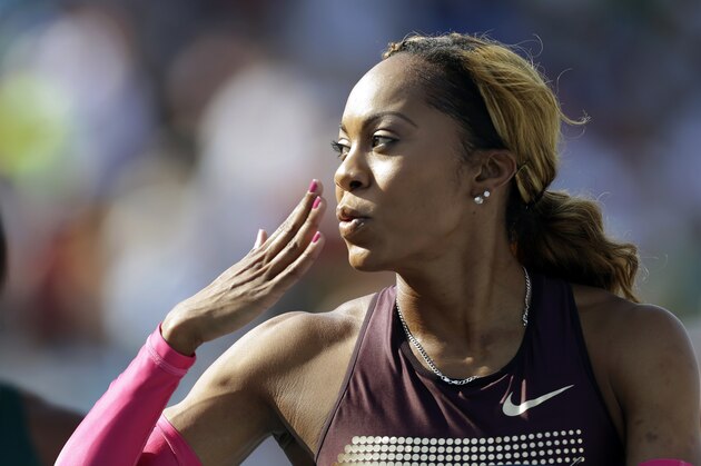 Sanya Richards-Ross blows a kiss to the crowd after her senior women's 400-meter run heat at the U.S. Championships athletics meet, Thursday, June 20, 2013, in Des Moines, Iowa. (AP Photo/Charlie Neibergall)