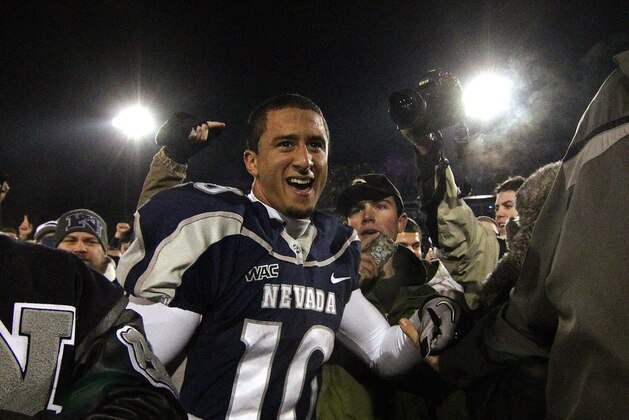 Nevada Wolf Pack quarterback Colin Kaepernick celebrates with fans as he leaves the field after a 34-31overtime win over Boise State during the NCAA college football game Friday night, Nov. 26, 2010, in Reno, Nev. (AP Photo/Cathleen Allison)