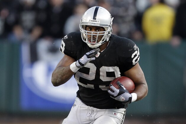 Oakland Raiders running back Michael Bush (29) against the Detroit Lions in an NFL football game in Oakland, Calif., Sunday, Dec. 18, 2011.  (AP Photo/Paul Sakuma)