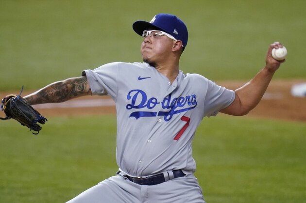Los Angeles Dodgers' Julio Urias delivers to the San Diego Padres during the second inning in Game 3 of a baseball National League Division Series Thursday, Oct. 8, 2020, in Arlington, Texas. (AP Photo/Sue Ogrocki)