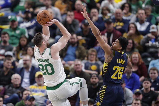 Boston Celtics forward Gordon Hayward (20) shoots over Indiana Pacers guard Jeremy Lamb (26) during the first half of an NBA basketball game in Indianapolis, Wednesday, Dec. 11, 2019. (AP Photo/Michael Conroy) Boston Celtics forward Gordon Hayward (20) shoots over Indiana Pacers guard Jeremy Lamb (26) during the first half of an NBA basketball game in Indianapolis, Wednesday, Dec. 11, 2019. (AP Photo/Michael Conroy)