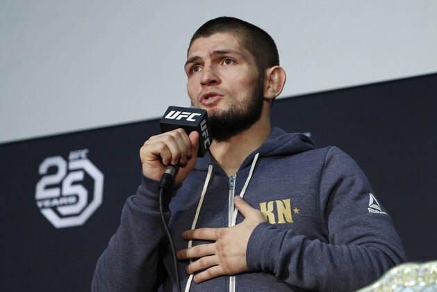FILE - In this Saturday, Oct. 6, 2018 file photo Khabib Nurmagomedov speaks at a news conference after the UFC 229 mixed martial arts event in Las Vegas. UFC champion Khabib Nurmagomedov is probably the best-known Muslim athlete in Russia, and he's rapidly becoming a leading conservative voice at home. When a National Guardsman was killed while apparently trying to break up a fight outside an establishment variously described as a cafe and nightclub early Sunday morning, Nurmagomedov called for a crackdown on the local nightlife in his mostly-Muslim home region of Dagestan.(AP Photo/John Locher, File)
